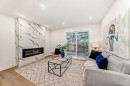 29-2519 38 Street Ne, Calgary, AB  - Indoor Photo Showing Living Room With Fireplace 
