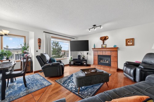 197 Arbour Stone Close Nw, Calgary, AB - Indoor Photo Showing Living Room With Fireplace