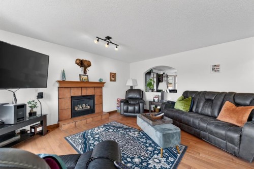 197 Arbour Stone Close Nw, Calgary, AB - Indoor Photo Showing Living Room With Fireplace