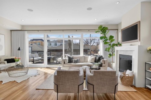 2011 43 Avenue Sw, Calgary, AB - Indoor Photo Showing Living Room With Fireplace