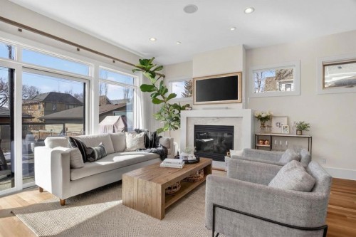2011 43 Avenue Sw, Calgary, AB - Indoor Photo Showing Living Room With Fireplace