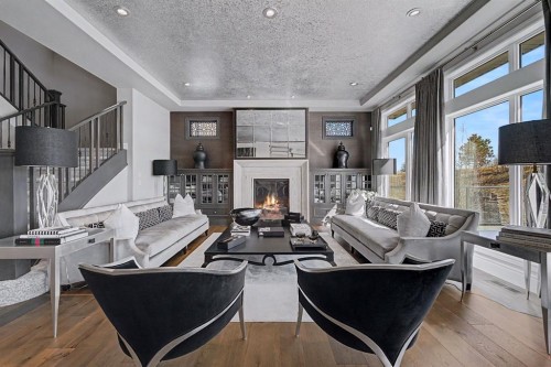 33 Waters Edge Drive, Heritage Pointe, AB - Indoor Photo Showing Living Room With Fireplace