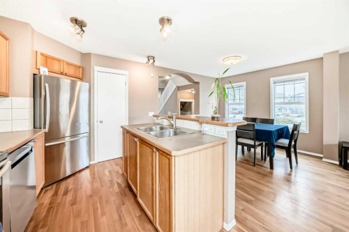 273 Tuscany Springs Way Nw, Calgary, AB - Indoor Photo Showing Kitchen With Double Sink