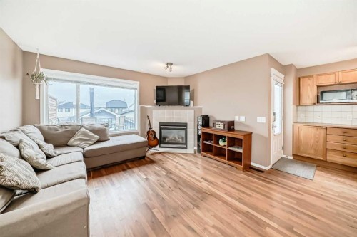 273 Tuscany Springs Way Nw, Calgary, AB - Indoor Photo Showing Living Room With Fireplace