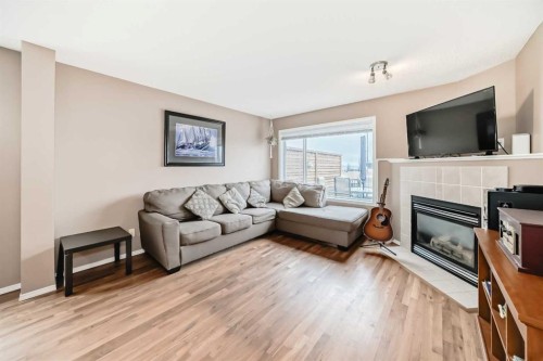 273 Tuscany Springs Way Nw, Calgary, AB - Indoor Photo Showing Living Room With Fireplace