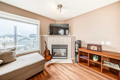 273 Tuscany Springs Way Nw, Calgary, AB - Indoor Photo Showing Living Room With Fireplace