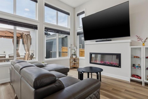 87 Aquila Way Nw, Calgary, AB - Indoor Photo Showing Living Room With Fireplace