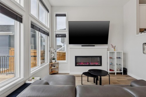 87 Aquila Way Nw, Calgary, AB - Indoor Photo Showing Living Room With Fireplace
