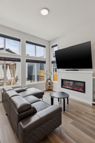 87 Aquila Way Nw, Calgary, AB - Indoor Photo Showing Living Room With Fireplace