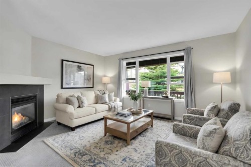 154 Everglen Rise Sw, Calgary, AB - Indoor Photo Showing Living Room With Fireplace