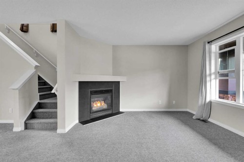 154 Everglen Rise Sw, Calgary, AB - Indoor With Fireplace