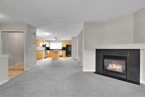 154 Everglen Rise Sw, Calgary, AB - Indoor Photo Showing Living Room With Fireplace