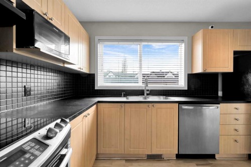 154 Everglen Rise Sw, Calgary, AB - Indoor Photo Showing Kitchen With Double Sink