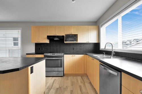 154 Everglen Rise Sw, Calgary, AB - Indoor Photo Showing Kitchen With Double Sink
