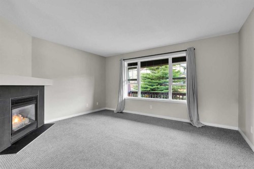 154 Everglen Rise Sw, Calgary, AB - Indoor Photo Showing Living Room With Fireplace
