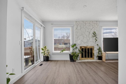 55 Falwood Place Ne, Calgary, AB - Indoor With Fireplace