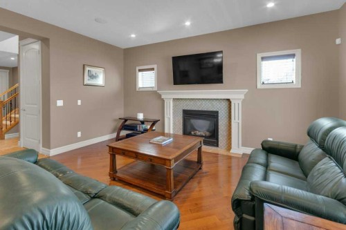 44 Mahogany Rise Se, Calgary, AB - Indoor Photo Showing Living Room With Fireplace