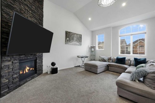 17 Yorkstone Way Sw, Calgary, AB - Indoor Photo Showing Living Room With Fireplace