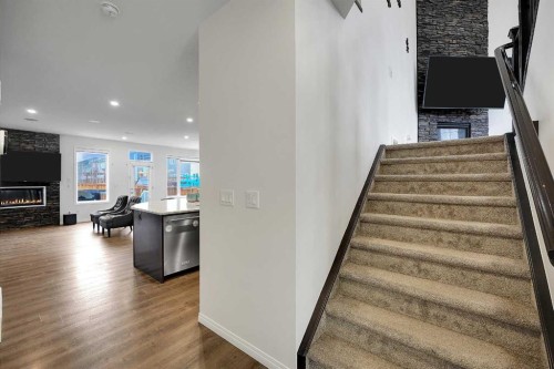 17 Yorkstone Way Sw, Calgary, AB - Indoor Photo Showing Other Room With Fireplace