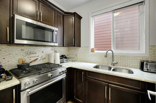 17 Yorkstone Way Sw, Calgary, AB - Indoor Photo Showing Kitchen With Double Sink With Upgraded Kitchen