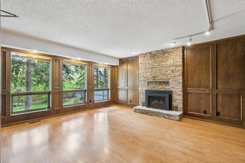 124 Edgehill Close Nw, Calgary, AB - Indoor Photo Showing Living Room With Fireplace