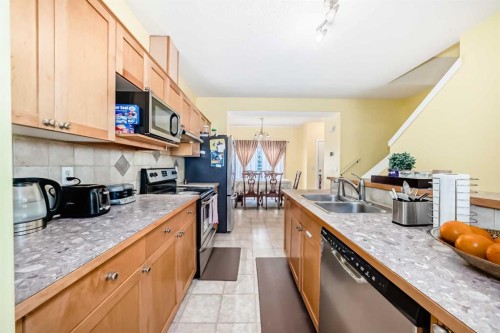 187 Bridlewood View Sw, Calgary, AB - Indoor Photo Showing Kitchen With Double Sink