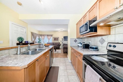 187 Bridlewood View Sw, Calgary, AB - Indoor Photo Showing Kitchen With Double Sink