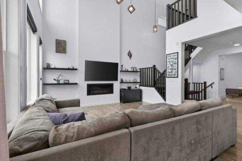 45 Evansfield Manor Nw, Calgary, AB - Indoor Photo Showing Living Room With Fireplace