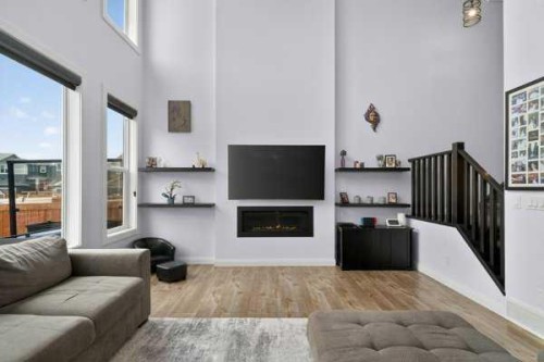 45 Evansfield Manor Nw, Calgary, AB - Indoor Photo Showing Living Room With Fireplace