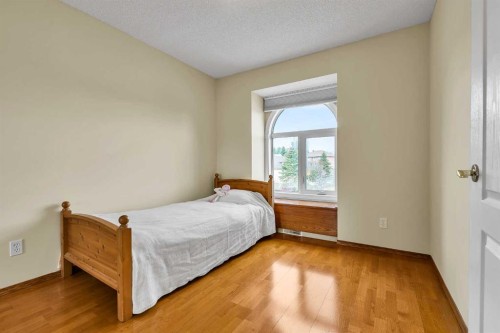 28 Woodpark Close Sw, Calgary, AB - Indoor Photo Showing Bedroom