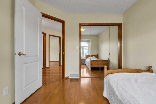 28 Woodpark Close Sw, Calgary, AB - Indoor Photo Showing Bedroom