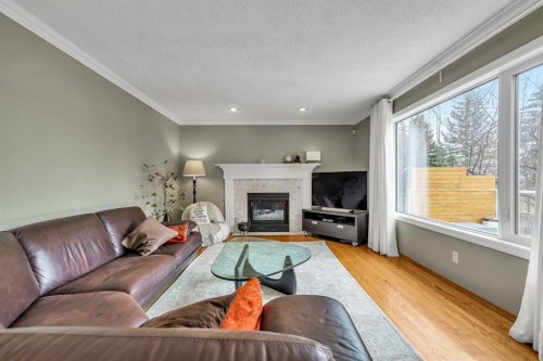 28 Woodpark Close Sw, Calgary, AB - Indoor Photo Showing Living Room With Fireplace