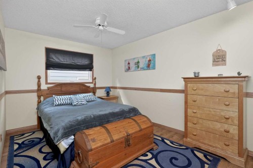 80 Deerbrook Road Se, Calgary, AB - Indoor Photo Showing Bedroom