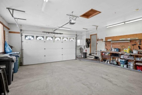 80 Deerbrook Road Se, Calgary, AB - Indoor Photo Showing Garage