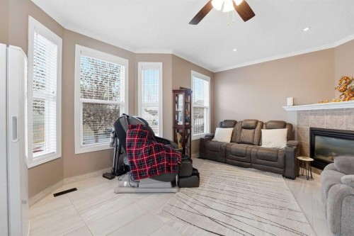 23 Prestwick Park Se, Calgary, AB - Indoor Photo Showing Living Room With Fireplace