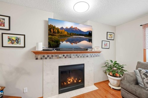 127 Kincora Heights Nw, Calgary, AB - Indoor Photo Showing Living Room With Fireplace