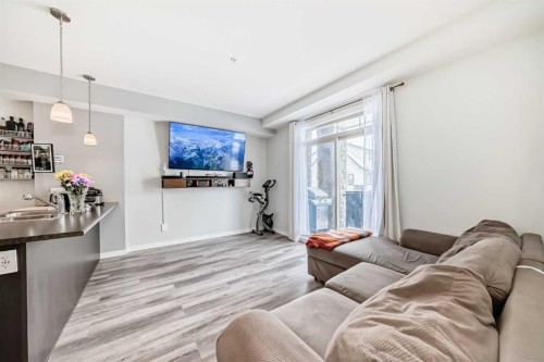 101-117 Copperpond Common Se, Calgary, AB - Indoor Photo Showing Living Room
