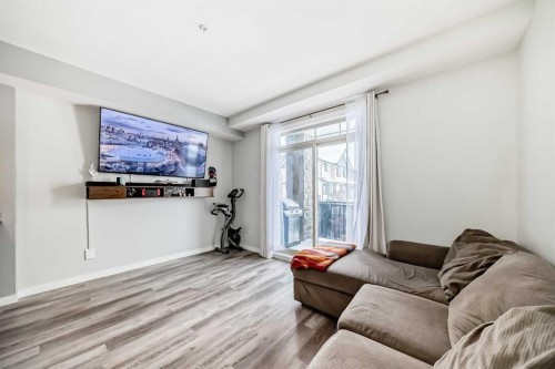 101-117 Copperpond Common Se, Calgary, AB - Indoor Photo Showing Living Room