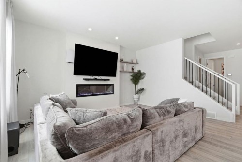 54 Belmont Manor Sw, Calgary, AB - Indoor Photo Showing Living Room With Fireplace