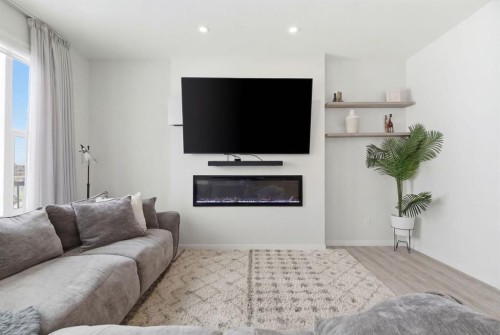 54 Belmont Manor Sw, Calgary, AB - Indoor Photo Showing Living Room With Fireplace
