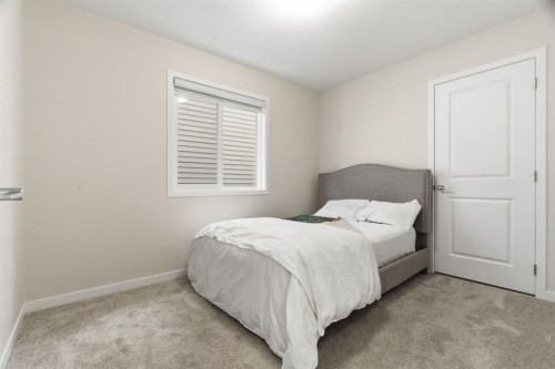 54 Belmont Manor Sw, Calgary, AB - Indoor Photo Showing Bedroom