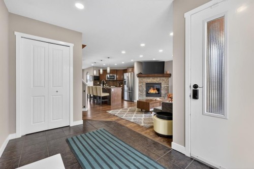 180 Walden Gate Se, Calgary, AB - Indoor Photo Showing Other Room With Fireplace