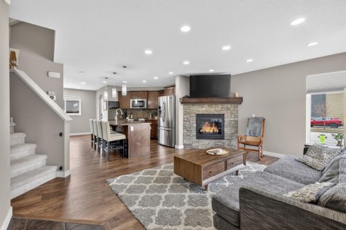 180 Walden Gate Se, Calgary, AB - Indoor Photo Showing Living Room With Fireplace