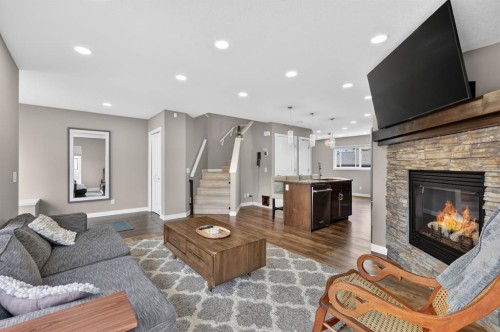180 Walden Gate Se, Calgary, AB - Indoor Photo Showing Living Room With Fireplace