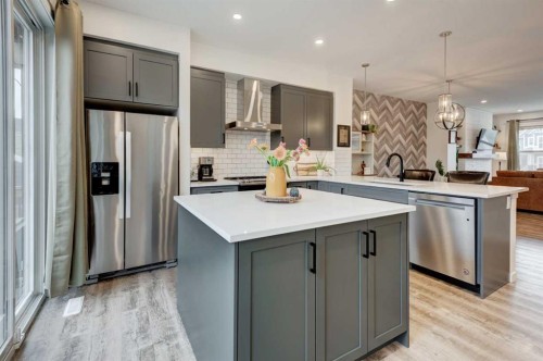 146 Magnolia Square Se, Calgary, AB - Indoor Photo Showing Kitchen With Stainless Steel Kitchen With Upgraded Kitchen