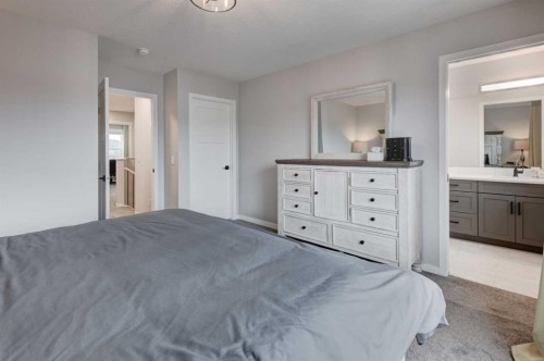 146 Magnolia Square Se, Calgary, AB - Indoor Photo Showing Bedroom