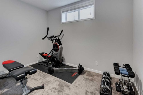 146 Magnolia Square Se, Calgary, AB - Indoor Photo Showing Gym Room