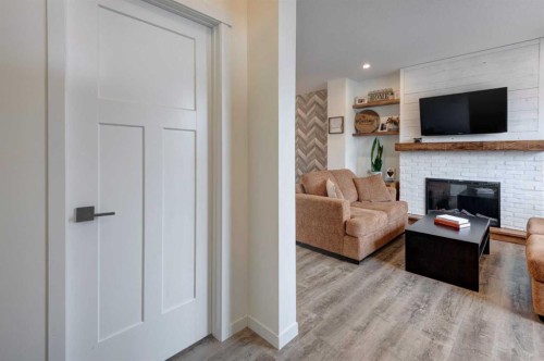 146 Magnolia Square Se, Calgary, AB - Indoor With Fireplace