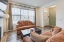 146 Magnolia Square Se, Calgary, AB  - Indoor Photo Showing Living Room With Fireplace 