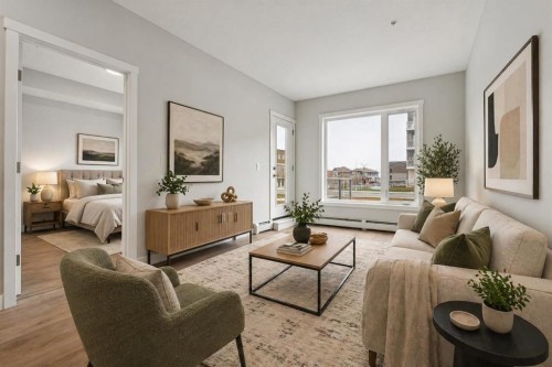 103-655 Shawnee Square Sw, Calgary, AB - Indoor Photo Showing Living Room